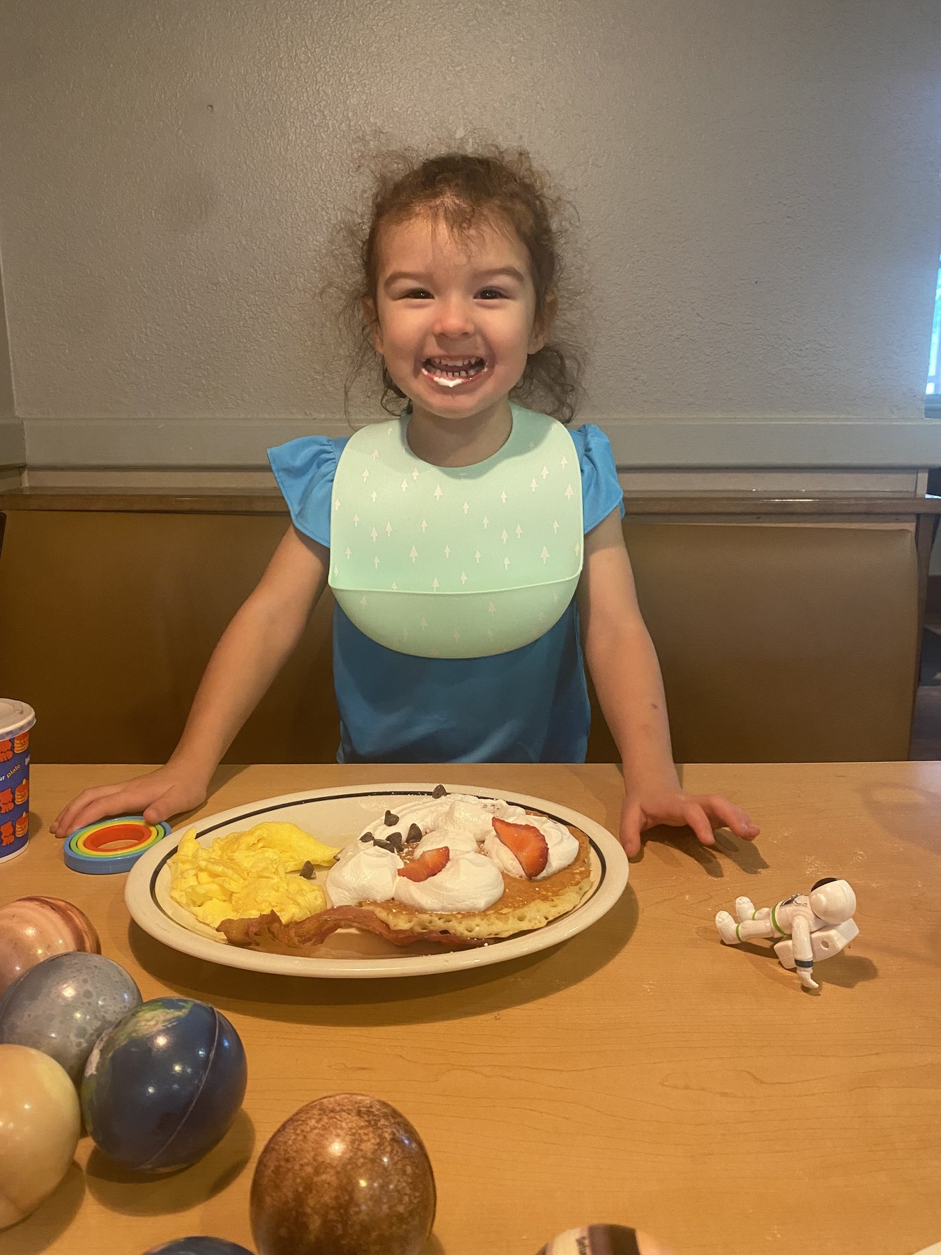 Skye enjoying delicious pancakes at dinner