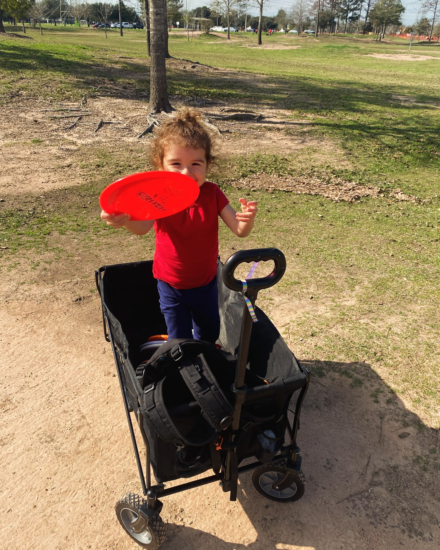 Skye out disc golfing outdoors with Dad