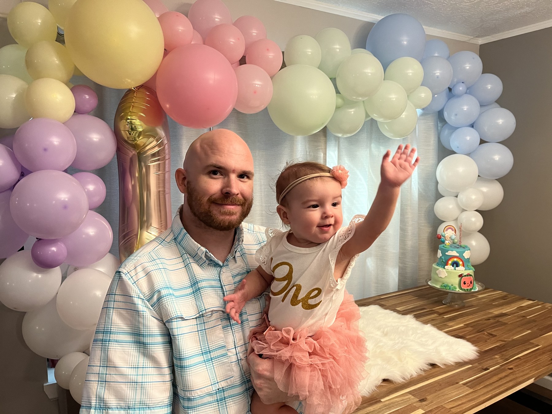 Skye celebrating her first birthday with a big smile
