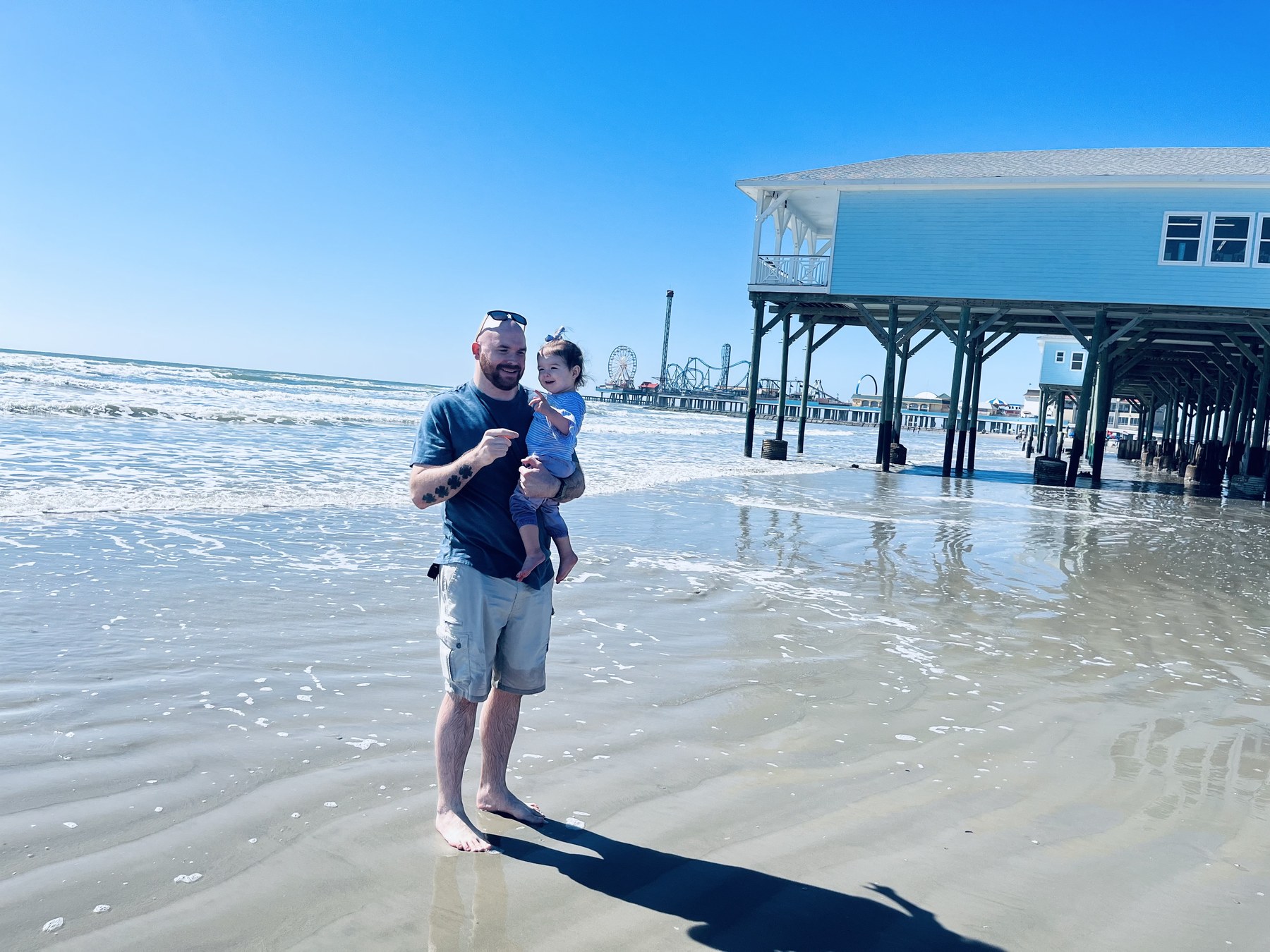 Skye and Dad enjoying the sand and waves at Galveston Beach