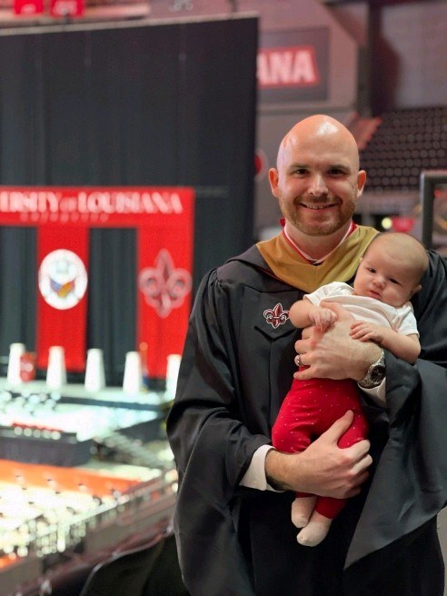 Dad and Skye celebrating Dad's graduation